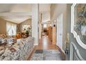 Spacious foyer featuring hardwood floors, high ceilings, and seamless access to the living areas at 17038 Lamar Dr, Parker, CO 80134