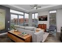 Bright living room featuring modern furnishings, a cozy sofa, and floor-to-ceiling windows at 4200 W 17Th Ave # 323, Denver, CO 80204
