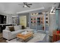 Spacious living room with hardwood floors, comfortable seating, and an open floor plan at 4200 W 17Th Ave # 323, Denver, CO 80204