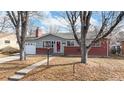 Charming single-story home with brick accents and a well-maintained front yard at 3246 S Stuart St, Denver, CO 80236