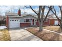 Charming single-story home with brick accents and a well-maintained front yard at 3246 S Stuart St, Denver, CO 80236