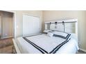 Cozy bedroom with a comfortable bed, stylish headboard, and ample closet space at 17855 Lake Side Dr, Monument, CO 80132
