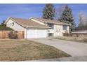 Ranch style home with a two-car garage and fenced backyard at 1536 S Wright Ct, Lakewood, CO 80228