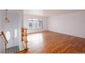 Spacious living room with hardwood floors and large window at 1536 S Wright Ct, Lakewood, CO 80228