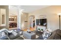 Open concept living room with views into the dining room and kitchen at 12444 Knox Ct, Broomfield, CO 80020