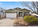 House exterior with landscaping and driveway at 7139 Pine Hills Way, Littleton, CO 80125