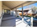 Inviting outdoor patio area, perfect for entertaining with elegant decking and a secure gated entry at 2601 S Quebec St # 6, Denver, CO 80231