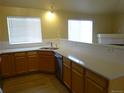 Bright kitchen with wood cabinets, stainless steel appliances and modern countertops at 3271 E 103Rd Pl # 1307, Thornton, CO 80229