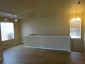 Loft with vaulted ceilings, wood flooring and windows allowing for natural light at 3271 E 103Rd Pl # 1307, Thornton, CO 80229