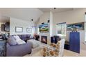 Cozy living room features a fireplace, vaulted ceilings, and comfortable seating arrangements at 12604 Madison Way, Thornton, CO 80241