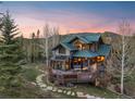 Charming mountain home featuring a walk-out deck and beautiful stone walkway at 23 Verde Ct, Breckenridge, CO 80424