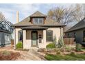 Charming single-Gathering home featuring light brick and well-maintained landscaping at 3534 Decatur St, Denver, CO 80211