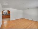 Living room with hardwood floors and kitchen view at 12152 E Dakota Ave, Aurora, CO 80012