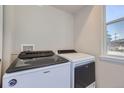 Laundry room with Whirlpool washer and dryer at 9490 W 14Th Ave # 3, Lakewood, CO 80215