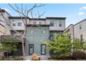 Modern townhome with neutral exterior, balcony, and a well-maintained front yard at 2521 Moline St, Aurora, CO 80010