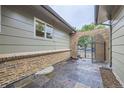 Brick archway leading to a slate patio at 1010 Ash St, Broomfield, CO 80020