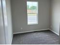 Cozy carpeted bedroom offers a calm and relaxing space at 1759 Jennifer St, Brighton, CO 80601