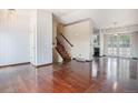 Spacious living room boasts hardwood floors and staircase access at 1947 S Ouray St, Aurora, CO 80013