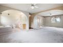 Large main bedroom featuring two ceiling fans and an ensuite bath at 1947 S Ouray St, Aurora, CO 80013