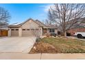 Charming single-story home featuring a three car garage, neutral siding, and well-kept front yard at 2687 E 124Th Pl, Thornton, CO 80241