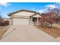 Charming single-Gathering home featuring a two-car garage and welcoming exterior at 157 Sand Cherry St, Brighton, CO 80601