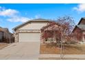 Charming single-Gathering home featuring a two-car garage and welcoming exterior at 157 Sand Cherry St, Brighton, CO 80601