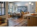Inviting dining area with a wooden table, custom bench seating, and a decorative chandelier at 208 N Ridge St, Breckenridge, CO 80424
