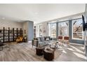 Bright living room featuring stylish furniture, hardwood floors, and an abundance of natural light at 1674 Fillmore St # Al3, Denver, CO 80206