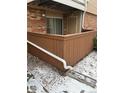 Patio area with wood fencing and a view of the condo's exterior at 3328 S Ammons St # 4-104, Lakewood, CO 80227