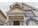 Close-up showcasing the intricate details of the porch with ornate trim and unique design at 2245 Julian St, Denver, CO 80211