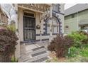 Inviting front entrance with a decorative security door and classic architectural elements at 2245 Julian St, Denver, CO 80211