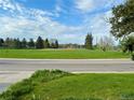 Scenic view of the expansive green space of the nearby park under a blue sky at 12046 W Green Mountain Dr, Lakewood, CO 80228