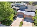 Bird's eye view of the home with mature trees and two car garage at 14562 W 3Rd Ave, Golden, CO 80401