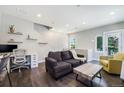 Bright and airy living room featuring modern decor, stylish furnishings, and a convenient home office setup at 2726 Federal Blvd # 1, Denver, CO 80211