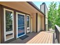 Inviting deck with wood flooring and views of surrounding lush greenery at 19235 Wakonda Way, Monument, CO 80132