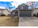 Charming two-story home with a well-maintained lawn and a gray two-car garage at 4630 E 135Th Way, Thornton, CO 80241