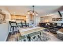 Open-concept space with a modern kitchen, dining area, and cozy living room with natural light at 815 Columbine Rd # 22, Breckenridge, CO 80424