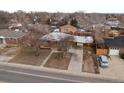 Aerial view showing the house, driveway, yard, and surrounding neighborhood at 11310 Irma Dr, Northglenn, CO 80233