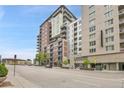 This is a view of a modern condo building in the city, featuring expansive windows and sleek architecture at 1401 Wewatta St # 202, Denver, CO 80202