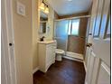 Updated bathroom featuring a glass-enclosed shower and a modern vanity at 1801 S Grove St, Denver, CO 80219