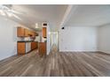 Bright living room with wood-look flooring and easy access to the updated kitchen at 16259 W 10Th Ave # A4, Golden, CO 80401