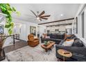 Spacious living room boasts a modern design, seamlessly connecting to the kitchen and staircase at 4555 Gray Wolf Ln, Castle Rock, CO 80104