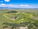 Expansive property featuring a beautiful home, pond, and plenty of space to roam with mountain views at 4586 Best Rd, Larkspur, CO 80118