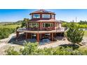 Unique home with a wrap around deck and ample outdoor space to enjoy the beautiful mountain views at 4586 Best Rd, Larkspur, CO 80118