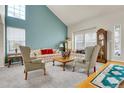 Spacious living room with large windows, comfortable seating, and elegant decor at 19939 E Belleview Ln, Centennial, CO 80015