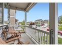 View from the covered front porch showing seating and other neighborhood houses at 4781 Rosette St, Castle Rock, CO 80104