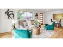 Cozy living room with stylish furniture, hardwood floors, and lots of natural light at 2067 Depew St, Edgewater, CO 80214