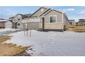 Well-maintained home featuring a two-car garage and nice landscaping at 16805 Greenfield Dr, Monument, CO 80132