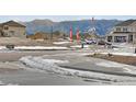 Street view of a new community with mountain views and modern homes at 16805 Greenfield Dr, Monument, CO 80132