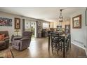 Spacious layout seamlessly connects the living room, dining area, and kitchen at 16328 E Phillips Ln, Englewood, CO 80112